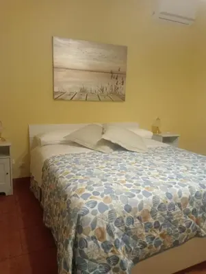 Letto o letti in una camera di Nucifora's House
