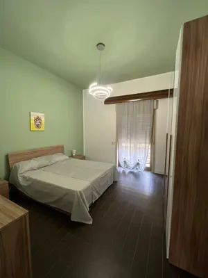 Letto o letti in una camera di La Rosa dello Jonio