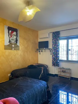 Letto o letti in una camera di Leopardi Holiday Home a due passi dal mare