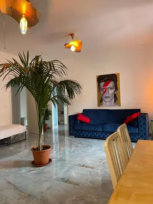 Area soggiorno di Leopardi Holiday Home a due passi dal mare