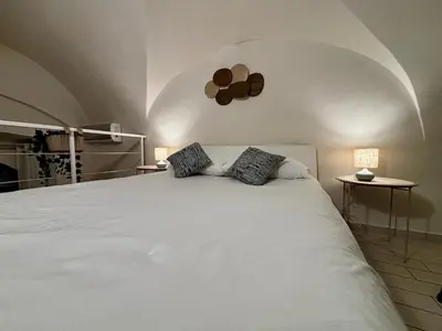 Letto o letti in una camera di Domus Santa Caterina
