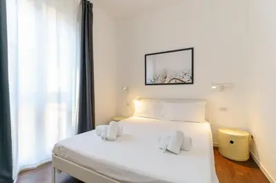 Letto o letti in una camera di Terrazza Cirnauti il pieno di luce in centro città