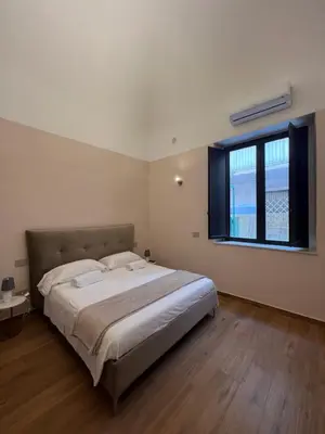 Letto o letti in una camera di Domus Catania Centro