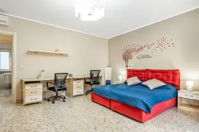 Letto o letti in una camera di GuestHost - Charming Apartment Near Villa Bellini in Catania