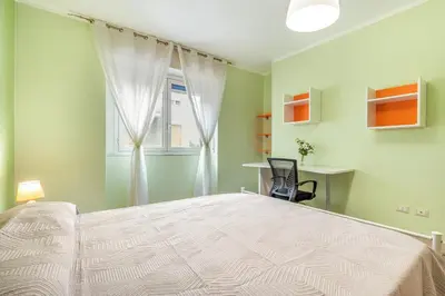 Letto o letti in una camera di GuestHost - Charming Apartment Near Villa Bellini in Catania