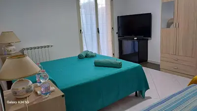 TV o dispositivi per l'intrattenimento presso Casa Vacanze AML Holidays Home