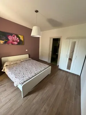 Letto o letti in una camera di B&B La Rosa dell'Etna - Appartamento completo