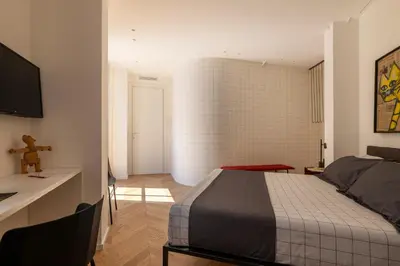 Letto o letti in una camera di Fra le righe - arte , design e interni siciliani