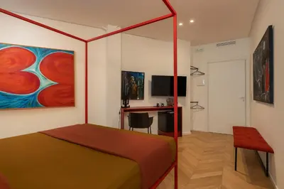 Letto o letti in una camera di Fra le righe - arte , design e interni siciliani
