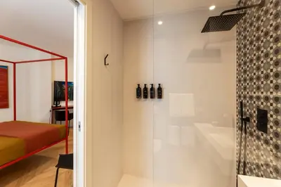 Letto o letti in una camera di Fra le righe - arte , design e interni siciliani