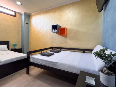 Letto o letti in una camera di Kira House