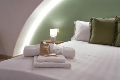 Letto o letti in una camera di R-HOME Crispi