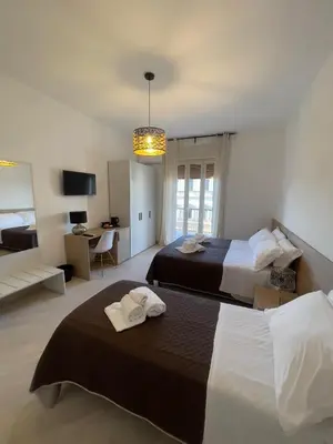 Letto o letti in una camera di Corso Italia 72