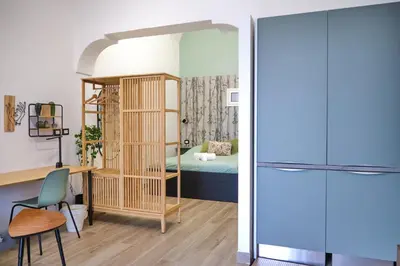 Letto o letti in una camera di Homely Catania