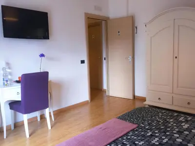 Letto o letti in una camera di Policlinico Apartments