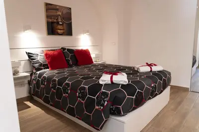 Letto o letti in una camera di SuiteCentralSolution
