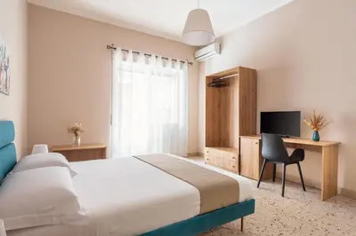 Letto o letti in una camera di San Vito Home