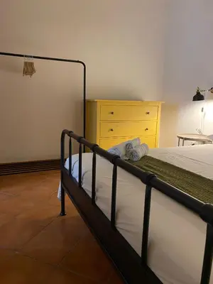 Letto o letti in una camera di Cortile Benedettini