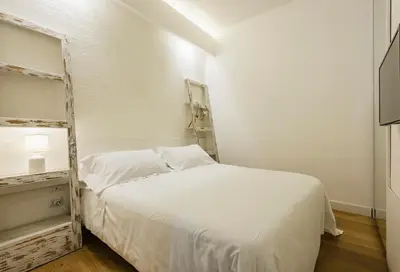 Letto o letti in una camera di Ferrini Home - Suites