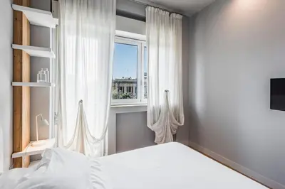 Letto o letti in una camera di Ferrini Home - Suites