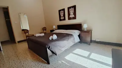 Letto o letti in una camera di Dimora Eliodoro