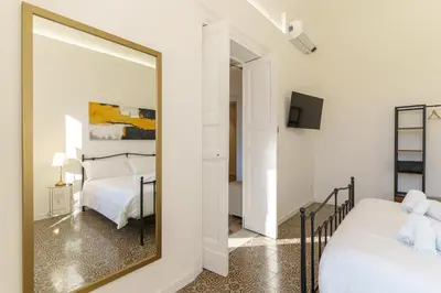 Letto o letti in una camera di KleoSuites