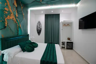 Letto o letti in una camera di 4 Rooms Rosario