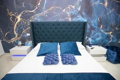 Letto o letti in una camera di 4 Rooms Rosario
