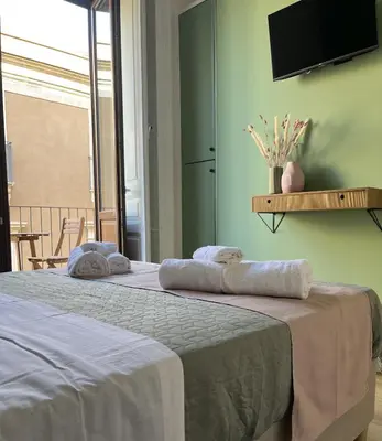 Letto o letti in una camera di Maison Etnea