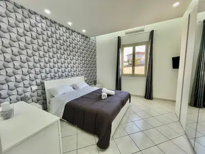 Letto o letti in una camera di Cold River House - Nesima apt