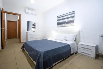 Letto o letti in una camera di Residence Rapisardi by RECEPTIO