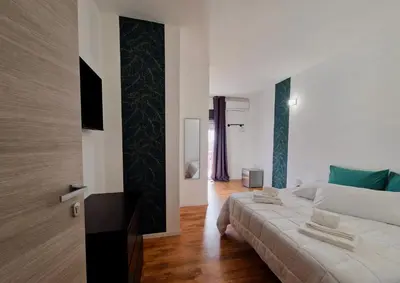 Letto o letti in una camera di Cambria Rooms & Apartments