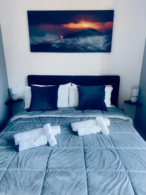 Letto o letti in una camera di Ma Maison Etnea