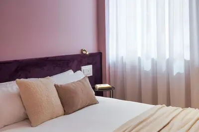 Letto o letti in una camera di Elysium Boutique Apartments - Catania