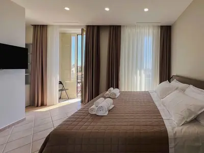Letto o letti in una camera di B&B Don Diego Pedara