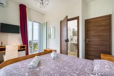 Letto o letti in una camera di Villa Antonio