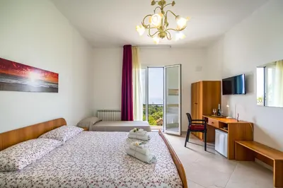 Letto o letti in una camera di Villa Antonio