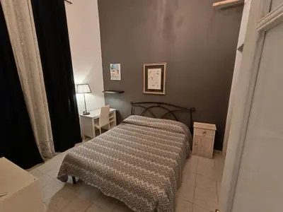 Letto o letti in una camera di Domus Etna