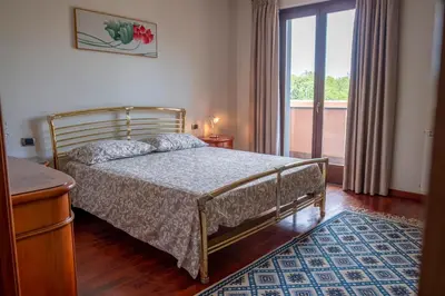 Letto o letti in una camera di Villa Etna da mare