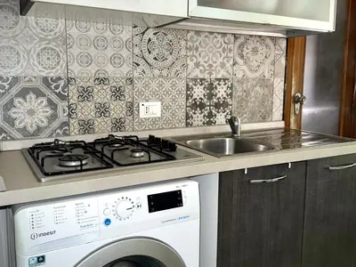 Cucina o angolo cottura di EnjoyCasa Tra Sole Mare e L'Etna