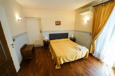 Letto o letti in una camera di Stesicorea Palace