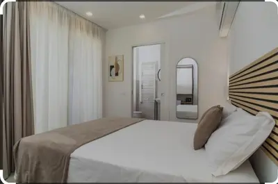 Letto o letti in una camera di sikelia rooms