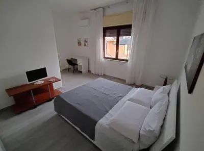 Letto o letti in una camera di Residence Scogliera