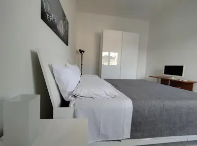 Letto o letti in una camera di Residence Scogliera