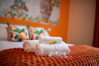 Letto o letti in una camera di Terra d'Agrumi Rooms