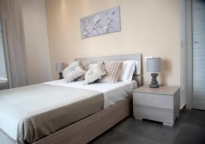 Letto o letti in una camera di La Rosa dell'Etna - Apartments