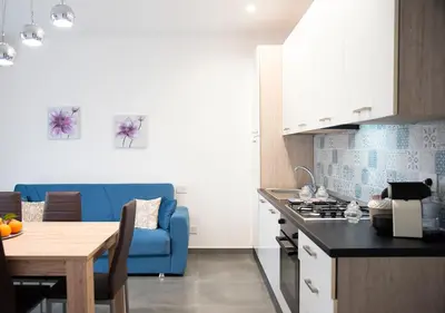Cucina o angolo cottura di La Rosa dell'Etna - Apartments