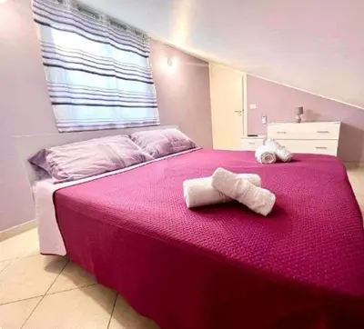 Letto o letti in una camera di la Casa di Gabriella