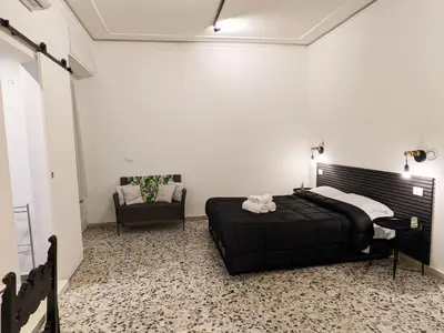 Letto o letti in una camera di Majorana's LabSuites