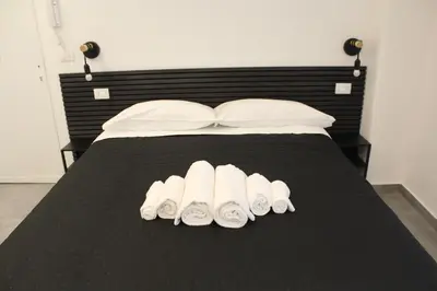 Letto o letti in una camera di Majorana's LabSuites